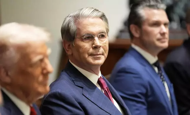 Treasury Secretary Scott Bessent and Defense Secretary Pete Hegseth listen as President Donald Trump speaks before a luncheon with Italy's Prime Minister Giorgia Meloni in the Cabinet Room of the White House, Thursday, April 17, 2025, in Washington. (AP Photo/Alex Brandon)