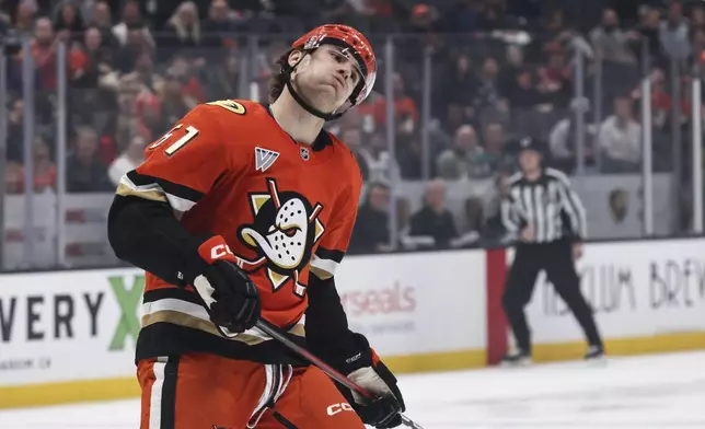 Anaheim Ducks winger Cutter Gauthier reacts after a missed opportunity to score against the Calgary Flames during the first period of an NHL hockey game, Wednesday, April 9, 2025, in Anaheim, Calif. (AP Photo/Etienne Laurent)