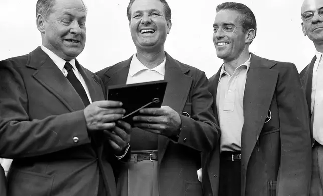 FILE - Bob Jones, president of Augusta National Golf Club, left, presents a plaque to Jimmy Demaret, center, as amateur Frank Stranahan, at right, looks on April 9, 1950 at the Augusta, Ga. (AP Photo, file)