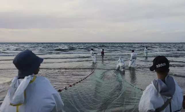 Palestinian fishermen pull their nets out of the Mediterranean Sea at the port of Gaza City, Tuesday, April 29, 2025. (AP Photo/Jehad Alshrafi)