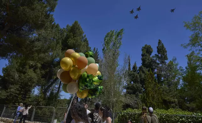 Israeli fighter jets fly over Mount Herzl military cemetery in Jerusalem, Tuesday, April 29, 2025. on the eve of Israel's Memorial Day for fallen soldiers. (AP Photo/Ohad Zwigenberg)