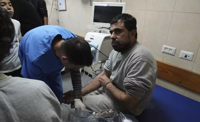 Freed Palestinian prisoner Samir Abu Ghanem, who was detain by the Israeli army during its ground operation in the Gaza Strip, arrives at al-Aqsa Hospital in Deir al-Balah, central Gaza, after his release from an Israeli prison, Tuesday, April 29, 2025. (AP Photo/Abdel Kareem Hana)