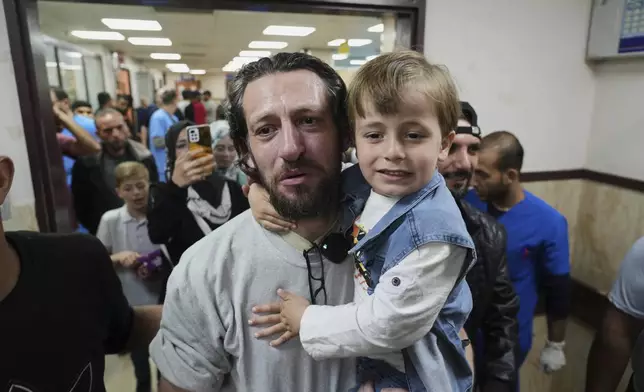 Freed Palestinian prisoner Mohammad Al-Sharif, who was detain by the Israeli army during its ground operation in the Gaza Strip, arrives at al-Aqsa Hospital in Deir al-Balah, central Gaza, after his release from an Israeli prison, Tuesday, April 29, 2025. (AP Photo/Abdel Kareem Hana)