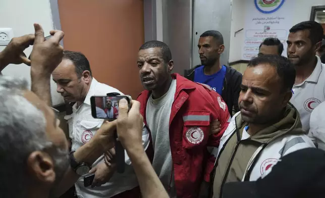 Asaad Al-Nsasrah, a paramedic with the Red Crescent whose colleagues were killed by Israeli army in southern Gaza, arrives at al-Aqsa Hospital in Deir al-Balah, central Gaza, on Tuesday, April 29, 2025, after being released from an Israeli prison. (AP Photo/Abdel Kareem Hana)