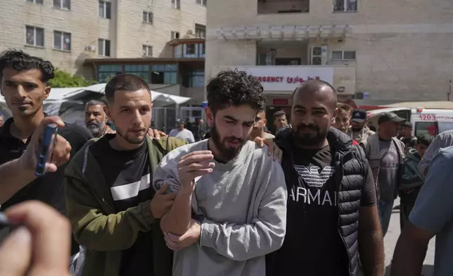 Freed Palestinian prisoner Mohammad Hijazi, who was detain by the Israeli army during its ground operation in the Gaza Strip, arrives at al-Aqsa Hospital in Deir al-Balah, central Gaza, after his release from an Israeli prison, Tuesday, April 29, 2025. (AP Photo/Abdel Kareem Hana)