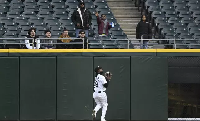 Chicago White Sox center fielder Luis Robert Jr. (88) catches a fly ball hit by Athletics' Tyler Soderstrom during the first inning of a baseball game Wednesday, April 16, 2025, in Chicago. (AP Photo/Paul Beaty)