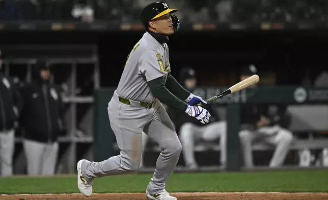 Athletics' Gio Urshela (13) watches his two-RBI triple during the sixth inning of a baseball game against the Chicago White Sox, Wednesday, April 16, 2025, in Chicago. (AP Photo/Paul Beaty)