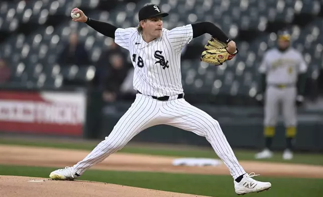 Chicago White Sox starter Jonathan Cannon delivers a pitch during the first inning of a baseball game against the Athletics Wednesday, April 16, 2025, in Chicago. (AP Photo/Paul Beaty)