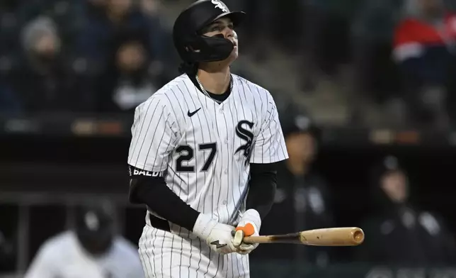 Chicago White Sox's Brooks Baldwin (27) watches his solo home run during the third inning of a baseball game against the Athletics Wednesday, April 16, 2025, in Chicago. (AP Photo/Paul Beaty)