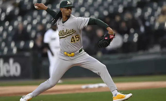 Athletics starter Osvaldo Bido delivers a pitch during the first inning of a baseball game against the Chicago White Sox Wednesday, April 16, 2025, in Chicago. (AP Photo/Paul Beaty)