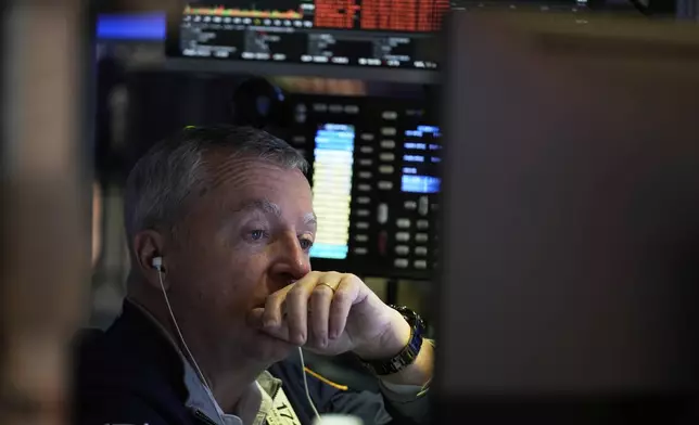 James Lamb works on the floor at the New York Stock Exchange in New York, Monday, April 7, 2025. (AP Photo/Seth Wenig)