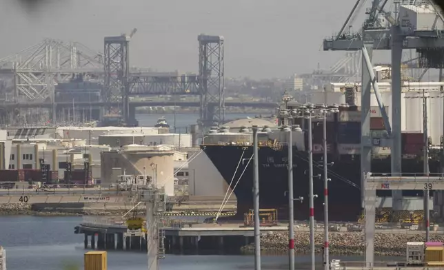 The YM Uniform container ship is docked at the Port of Los Angeles Wednesday, April 9, 2025, in Los Angeles. (AP Photo/Damian Dovarganes)