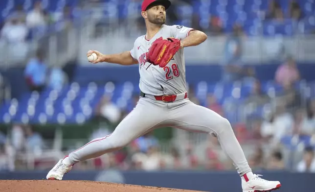 Cincinnati Reds starting pitcher Nick Martinez throws during the first inning of a baseball game against the Miami Marlins, Tuesday, April 22, 2025, in Miami. (AP Photo/Lynne Sladky)