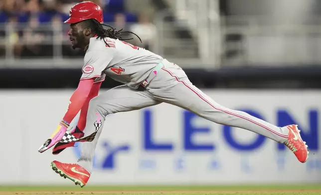 Cincinnati Reds' Elly De La Cruz steals second during the sixth inning of a baseball game against the Miami Marlins, Tuesday, April 22, 2025, in Miami. (AP Photo/Lynne Sladky)