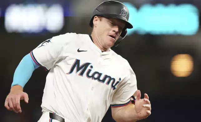 Miami Marlins' Eric Wagaman runs home to score on a RBI double hit by Agustin Ramirez during the sixth inning of a baseball game against the Cincinnati Reds, Tuesday, April 22, 2025, in Miami. (AP Photo/Lynne Sladky)