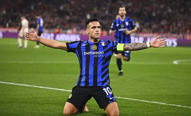 Inter Milan's Lautaro Martinez celebrates after scoring the opening goal during the Champions League quarterfinals first leg soccer match between FC Bayern Munich and Inter Milan, at the Allianz Arena in Munich, Germany, Tuesday, April 8, 2025. (Tom Weller/dpa via AP)