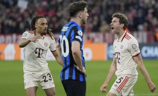 Bayern's Thomas Mueller, right, celebrates after scoring his side's opening goal during the Champions League quarterfinals first leg soccer match between FC Bayern Munich and Inter Milan, at the Allianz Arena in Munich, Germany, Tuesday, April 8, 2025. (AP Photo/Matthias Schrader)