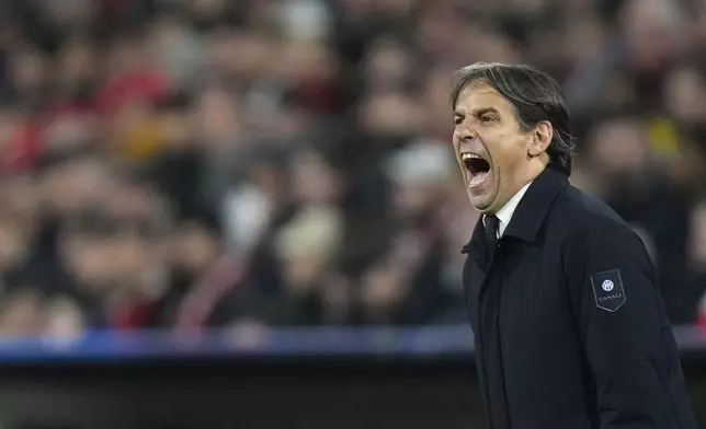 Inter Milan's head coach Simone Inzaghi reacts during the Champions League quarterfinals first leg soccer match between FC Bayern Munich and Inter Milan, at the Allianz Arena in Munich, Germany, Tuesday, April 8, 2025. (AP Photo/Matthias Schrader)