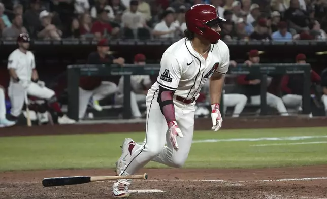 Arizona Diamondbacks' Alek Thomas hits a two run RBI single against the Milwaukee Brewers in the eighth inning during a baseball game, Sunday, April 13, 2025, in Phoenix. (AP Photo/Rick Scuteri)