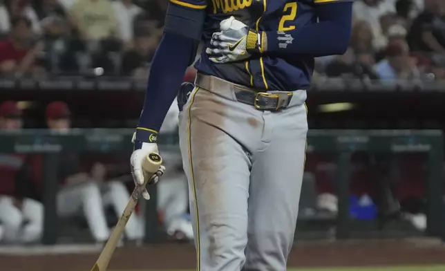 Milwaukee Brewers' Brice Turang reacts after getting hit with a pitch against the Arizona Diamondbacks in the fourth inning of an MLB baseball game, Sunday, April 13, 2025, in Phoenix. (AP Photo/Rick Scuteri)