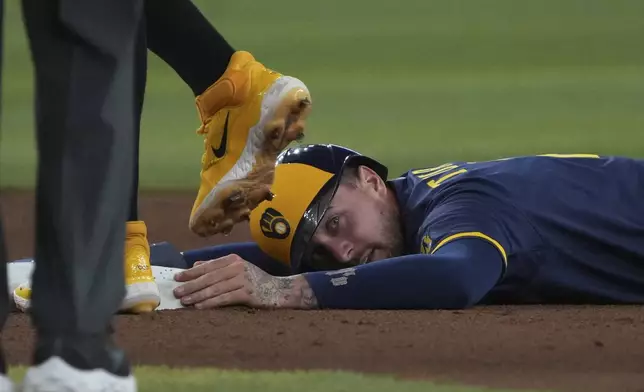 Milwaukee Brewers' Brice Turang reacts after stealing secondbase against the Arizona Diamondbacks in the seventh inning during a baseball game, Sunday, April 13, 2025, in Phoenix. (AP Photo/Rick Scuteri)