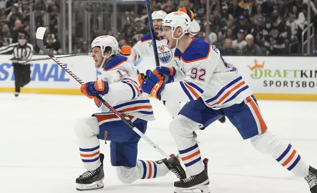 Edmonton Oilers center Mattias Janmark, left, celebrates his goal with right wing Vasily Podkolzin during the third period in Game 5 of an NHL hockey first-round playoff series against the Los Angeles Kings, Tuesday, April 29, 2025, in Los Angeles. (AP Photo/Mark J. Terrill)