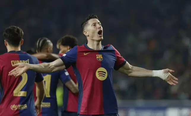 Barcelona's Robert Lewandowski celebrates after scoring his side's second goal during the Champions League quarterfinals first leg soccer match between Barcelona and Borussia Dortmund, at the Lluis Companys Olympic stadium in Barcelona, Spain, Wednesday, April 9, 2025. (AP Photo/Joan Monfort)
