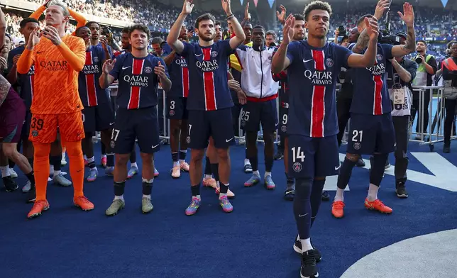 PSG's players celebrate winning the French League One championship title after the soccer match between Paris Saint-Germain and Angers at Parc des Princes stadium in Paris, Saturday, April 5, 2025. (Franck Fife, Pool Photo via AP)