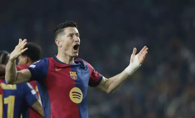 Barcelona's Robert Lewandowski celebrates after scoring his side's second goal during the Champions League quarterfinals first leg soccer match between Barcelona and Borussia Dortmund, at the Lluis Companys Olympic stadium in Barcelona, Spain, Wednesday, April 9, 2025. (AP Photo/Joan Monfort)
