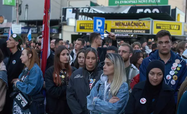 People observe seventeen minutes of silence during an anti-corruption protest led by university students in the southwestern town of Novi Pazar, Serbia, Saturday, April 12, 2025. (AP Photo/Marko Drobnjakovic)