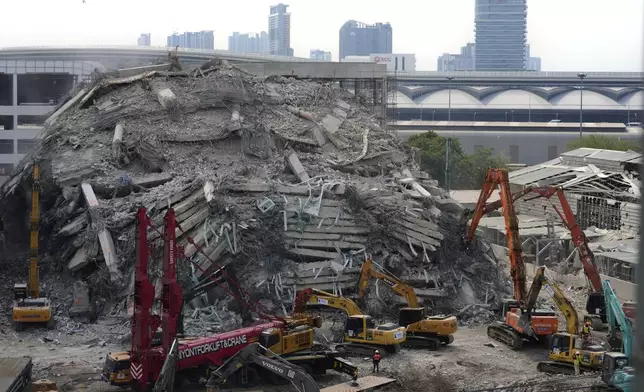 FILE - Heavy machineries are deployed to clear the rubble from an under construction high-rise building that collapsed after Friday's earthquake in Bangkok, Thailand, on April 2, 2025. (AP Photo/Manish Swarup, File)