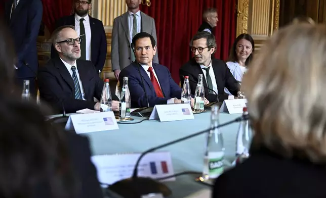 US Secretary of State Marco Rubio, center, and Germany's Political Director of the Ministry of Foreign Affairs Gunter Sautter, right, attend a meeting on Ukraine and its security, in Paris Thursday, April 17, 2025. (Julien de Rosa, Pool via AP)