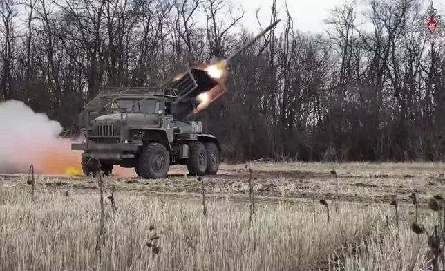 In this photo taken from video distributed by Russian Defense Ministry Press Service on Friday, April 18, 2025, the Russian BM-21 "Grad" self-propelled 122 mm multiple rocket launcher fires towards Ukrainian positions in Ukraine. (Russian Defense Ministry Press Service via AP)