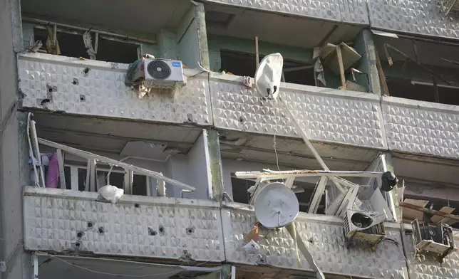 A residential building damaged by a Russian strike in Kharkiv, Ukraine, Friday April 18, 2025. (AP Photo/Andrii Marienko)