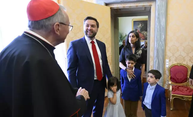 From left, Vatican Secretary of State Cardinal Pietro Parolin meets with U.S. Vice President JD Vance, his daughter Mirabel, his wife Usha, and their sons Ewan and Vivek at the Vatican, Saturday, April 19, 2025. (Vatican Media via AP, HO)