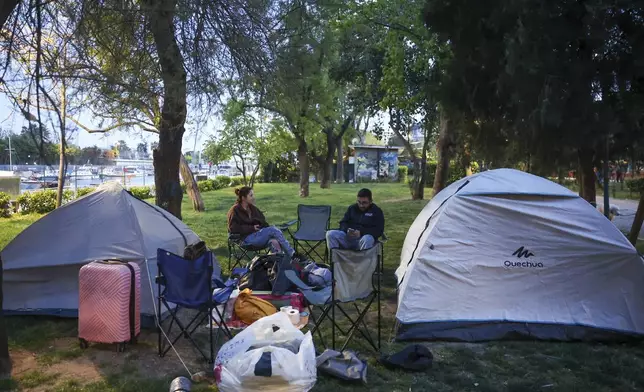 Locals camp in a public park following an earthquake shock with a preliminary magnitude of 6.2, in Istanbul, Turkey, Wednesday, April 23, 2025. (Berkman Ulutin/Dia Photo via AP)