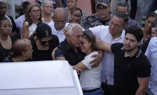 Family and friends attend the funeral of Marilenny Pilarte who died at the Jet Set nightclub when its roof collapsed, in Haina, Dominican Republic, Thursday, April 10, 2025. (AP Photo/Matias Delacroix)