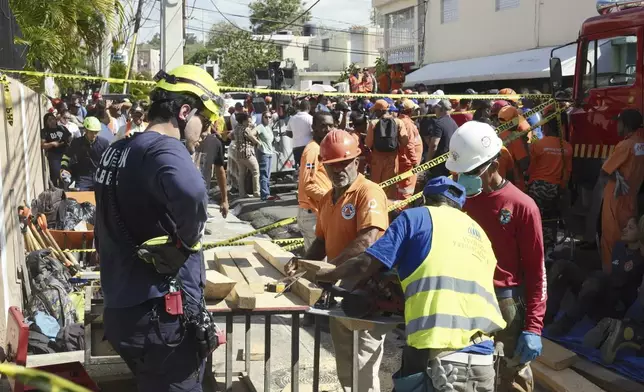 Workers search for survivors at the Jet Set nightclub after its roof collapsed during a merengue concert in Santo Domingo, Dominican Republic, Tuesday, April 8, 2025.(AP Photo/Ricardo Hernandez)