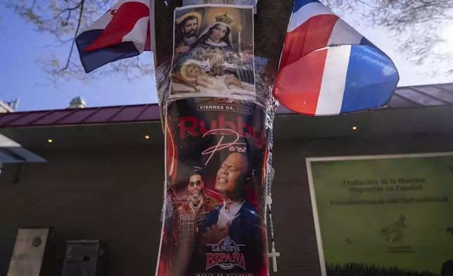 A poster of victim Rubby Perez is seen at a makeshift vigil for the victims of the Jet Set club roof collapse in the Dominican Republic, Wednesday, April 9, 2025, in New York. (AP Photo/Adam Gray)