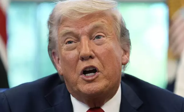 President Donald Trump speaks with reporters after signing executive orders in the Oval Office of the White House, Wednesday, April 23, 2025, in Washington. (AP Photo/Alex Brandon)