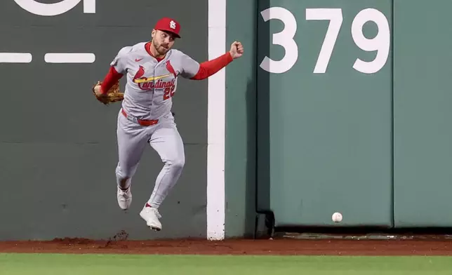 St. Louis Cardinals outfielder Michael Siani chases the ball after Boston Red Sox's Carlos Narváez hit for a double in the seventh inning during the second baseball game of a doubleheader, Sunday, April 6, 2025, in Boston. (AP Photo/Mark Stockwell)