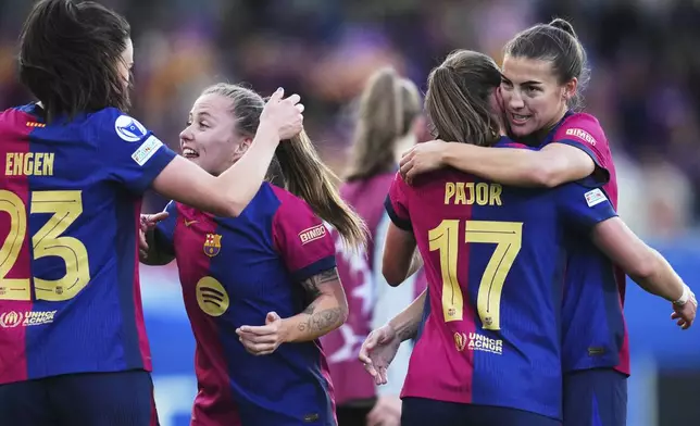 Barcelona's Ingrid Syrstad Engen, Claudia Pina, Ewa Pajor and Patri Guijarro, from left, celebrate after defeating Chelsea 4-1 in their women's Champions League semifinals, first leg, soccer match at the Johan Cruyff Stadium, in Sant Joan Despi, outside Barcelona, Spain, Sunday, April 20, 2025. (AP Photo/Bagu Blanco)