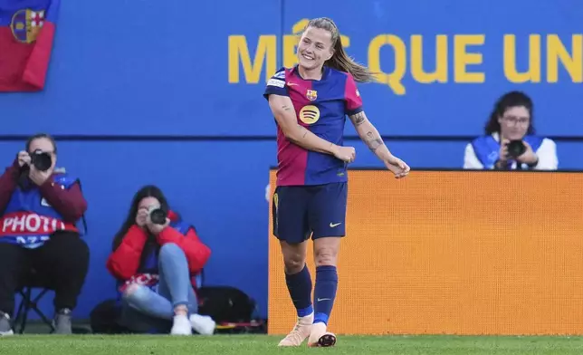Barcelona's Claudia Pina celebrates after scoring her side's fourth goal during the women's Champions League semifinals, first leg, soccer match between FC Barcelona and Chelsea FC at the Johan Cruyff Stadium, in Sant Joan Despi, outside Barcelona, Spain, Sunday, April 20, 2025. (AP Photo/Bagu Blanco)