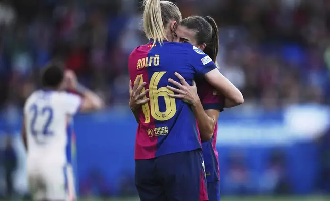 Barcelona's Fridolina Rolfo and Patri Guijarro, right, celebrate after defeating Chelsea 4-1 in their women's Champions League semifinals, first leg, soccer match at the Johan Cruyff Stadium, in Sant Joan Despi, outside Barcelona, Spain, Sunday, April 20, 2025. (AP Photo/Bagu Blanco)
