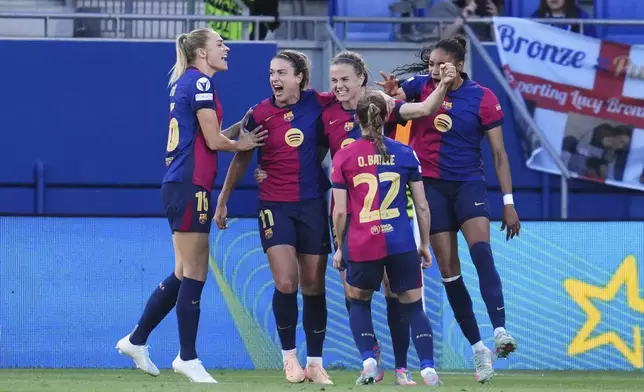 Barcelona's Irene Paredes, center, celebrates after scoring her side's third goal during the women's Champions League semifinals, first leg, soccer match between FC Barcelona and Chelsea FC at the Johan Cruyff Stadium, in Sant Joan Despi, outside Barcelona, Spain, Sunday, April 20, 2025. (AP Photo/Bagu Blanco)