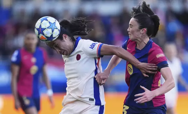 Barcelona's Ingrid Syrstad Engen vies for the ball with Chelsea's Mayra Ramirez, left, during the women's Champions League semifinals, first leg, soccer match between FC Barcelona and Chelsea FC at the Johan Cruyff Stadium, in Sant Joan Despi, outside Barcelona, Spain, Sunday, April 20, 2025. (AP Photo/Bagu Blanco)