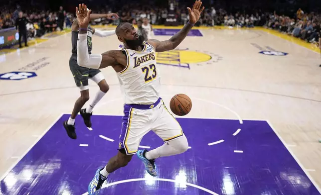 Los Angeles Lakers forward LeBron James dunks during the second half in Game 1 of an NBA first-round playoff series against the Minnesota Timberwolves, Saturday, April 19, 2025, in Los Angeles. (AP Photo/Mark J. Terrill)