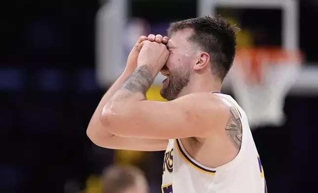 Los Angeles Lakers guard Luka Doncic reacts to a foul call that went against him during the first half in Game 1 of an NBA first-round playoff series against the Minnesota Timberwolves, Saturday, April 19, 2025, in Los Angeles. (AP Photo/Mark J. Terrill)