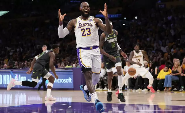 Los Angeles Lakers forward LeBron James, right, reacts after missing a pass during the first half in Game 1 of an NBA first-round playoff series against the Minnesota Timberwolves Saturday, April 19, 2025, in Los Angeles. (AP Photo/Mark J. Terrill)
