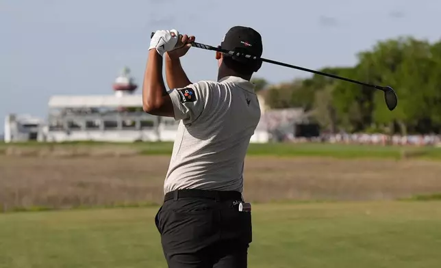 Si Woo Kim hits from the 18th tee during the third round of the RBC Heritage golf tournament, Saturday, April 19, 2025, in Hilton Head Island, S.C. (AP Photo/Mike Stewart)